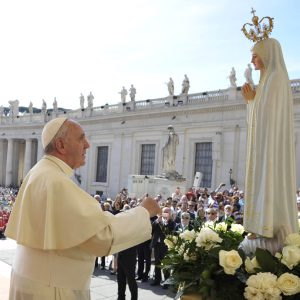 Pope Francis prays in front of statue of Our Lady of Fatima during general audience in St. Peter's Square at Vatican